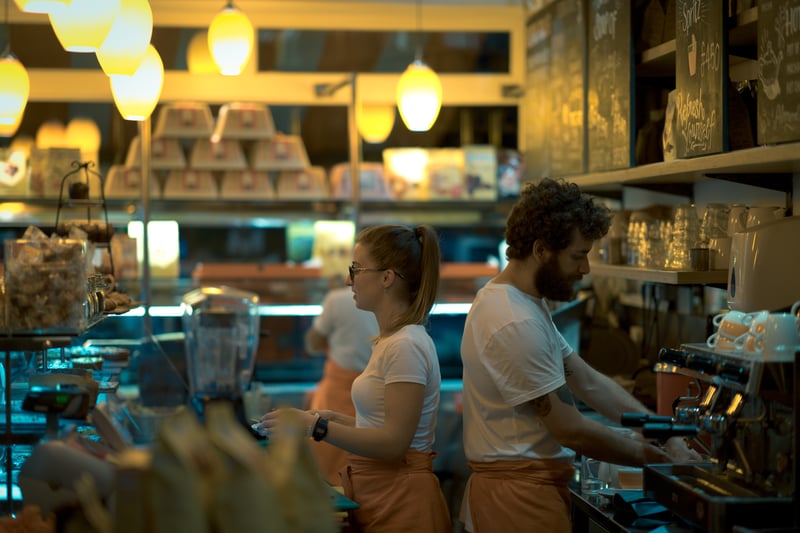 A photo of staff working within a cafe